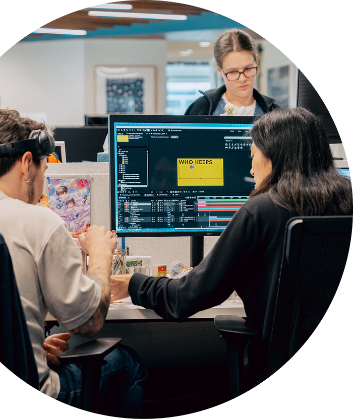 Avoq team collaborating at a desk